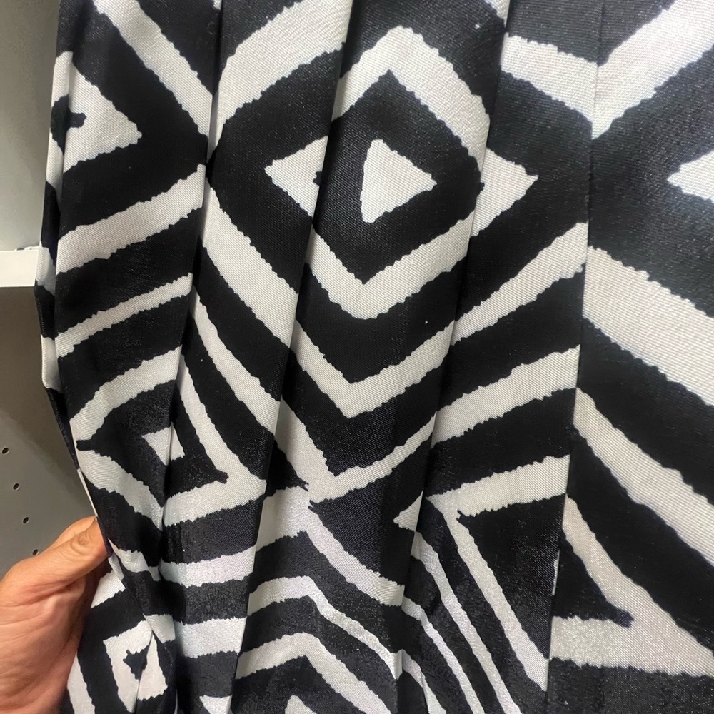 Black & white pleated. Knee length, full skirt